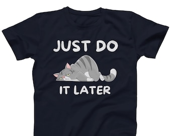 May include: A navy blue t-shirt with a cartoon cat and the text "Just Do It Later".