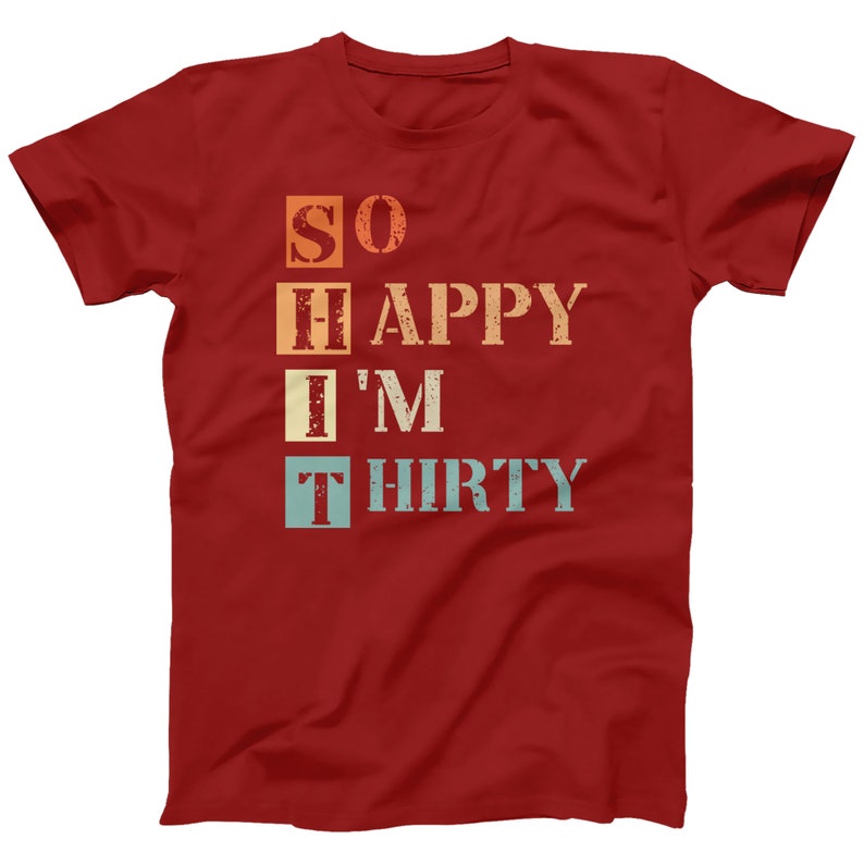 May include: Red t-shirt with a vintage-style graphic that reads "SO HAPPY I'M THIRTY".