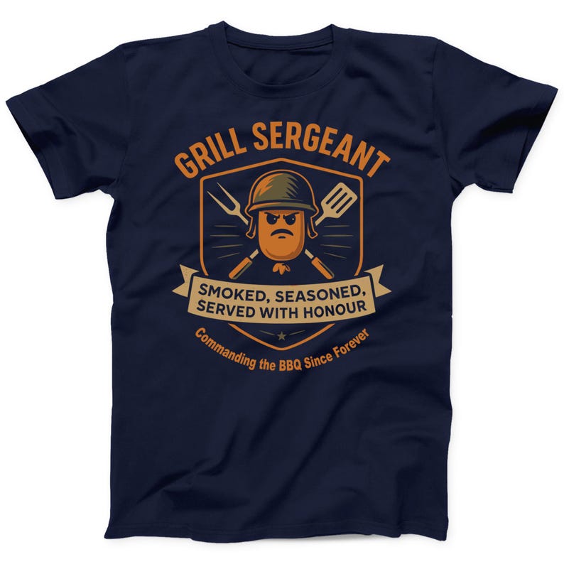 May include: Navy blue t-shirt with a humorous graphic. The design features a cartoon sausage wearing a helmet, crossed grilling tools, and the text "GRILL SERGEANT". Below, it reads "SMOKED, SEASONED, SERVED WITH HONOUR" and "Commanding the BBQ Since Forever".