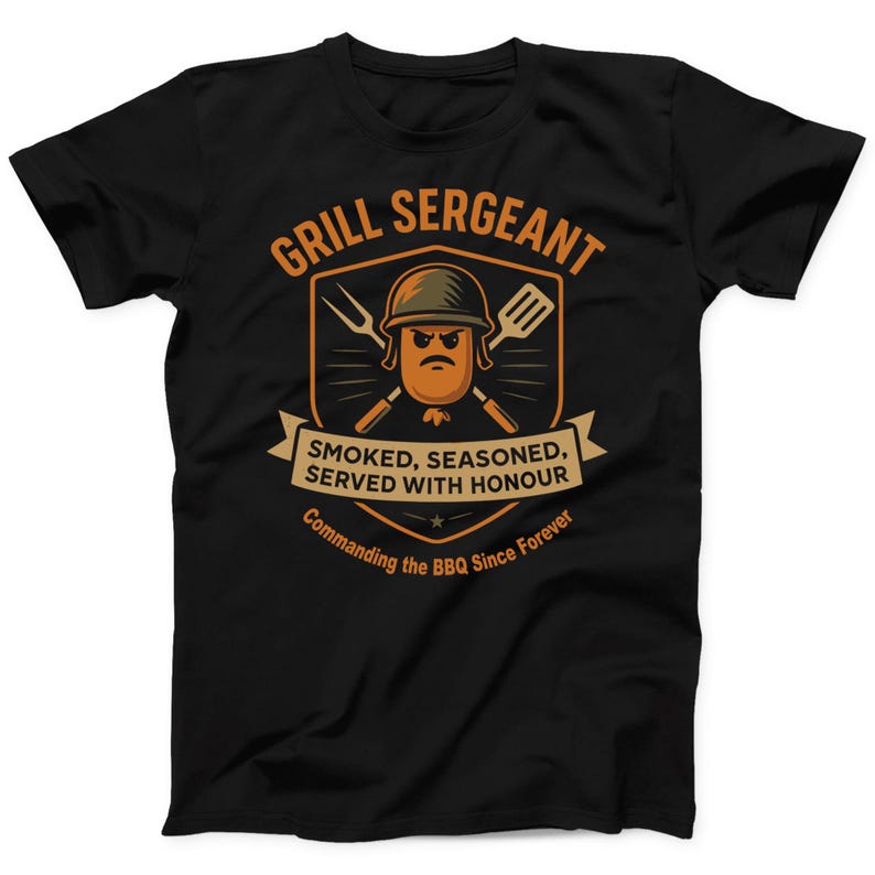 May include: Black t-shirt with a graphic design featuring a cartoon sausage wearing a helmet and holding grilling tools. The text reads "GRILL SERGEANT" and "SMOKED, SEASONED, SERVED WITH HONOUR". Below it says "Commanding the BBQ Since Forever".