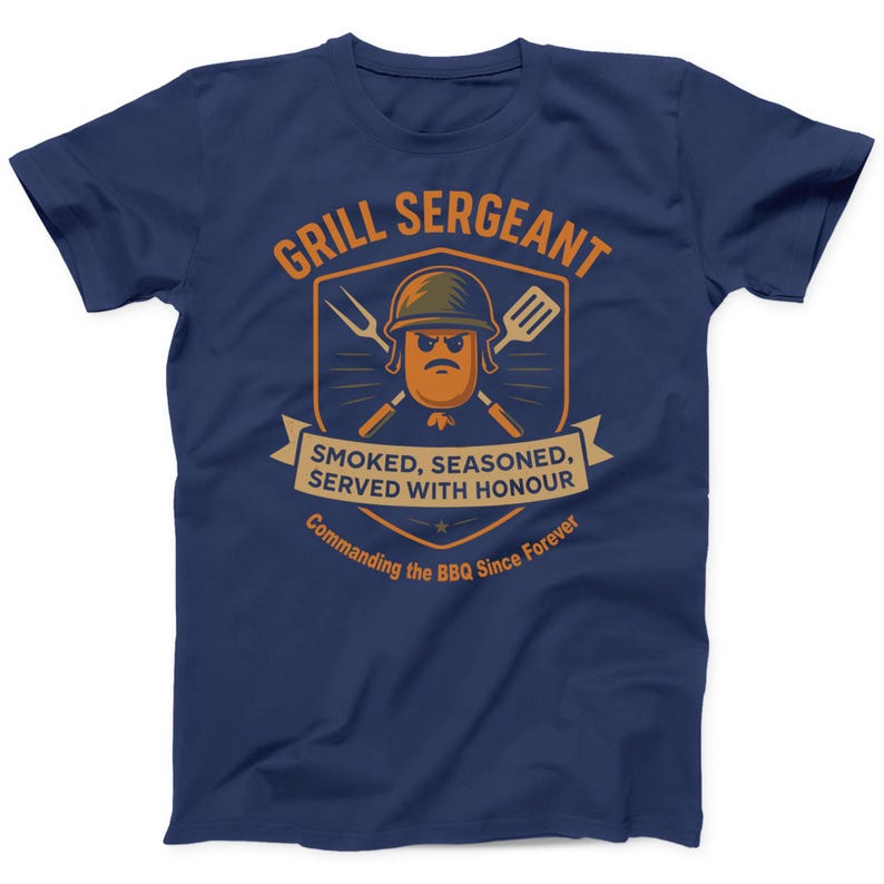 May include: Navy blue t-shirt with a humorous graphic. The design features a cartoon sausage character in a military helmet, crossed fork and spatula, and the text "GRILL SERGEANT". Below, it reads "SMOKED, SEASONED, SERVED WITH HONOUR" and "Commanding the BBQ Since Forever".