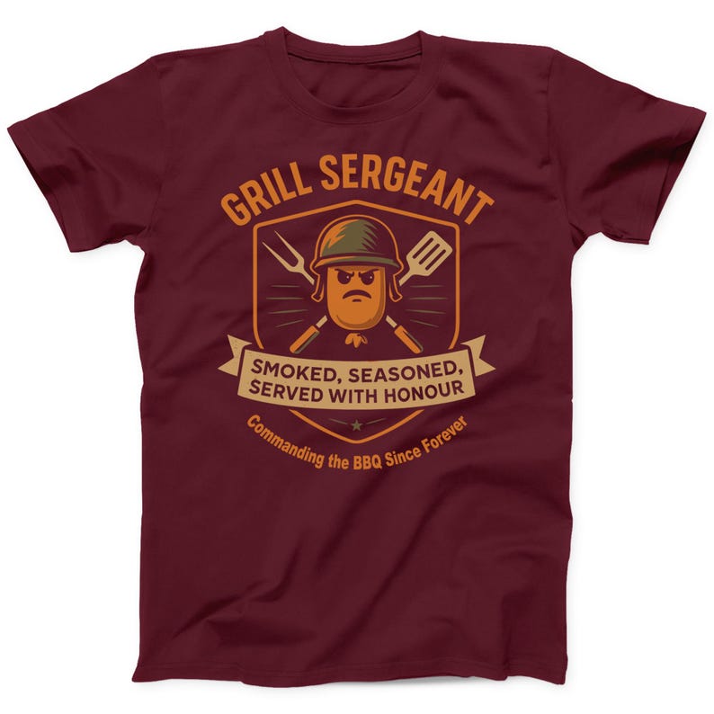 May include: Burgundy t-shirt with a humorous graphic. The design features a cartoon sausage wearing a military helmet, crossed grilling tools, and the text "GRILL SERGEANT". Below, a banner reads "SMOKED, SEASONED, SERVED WITH HONOUR" and "Commanding the BBQ Since Forever".