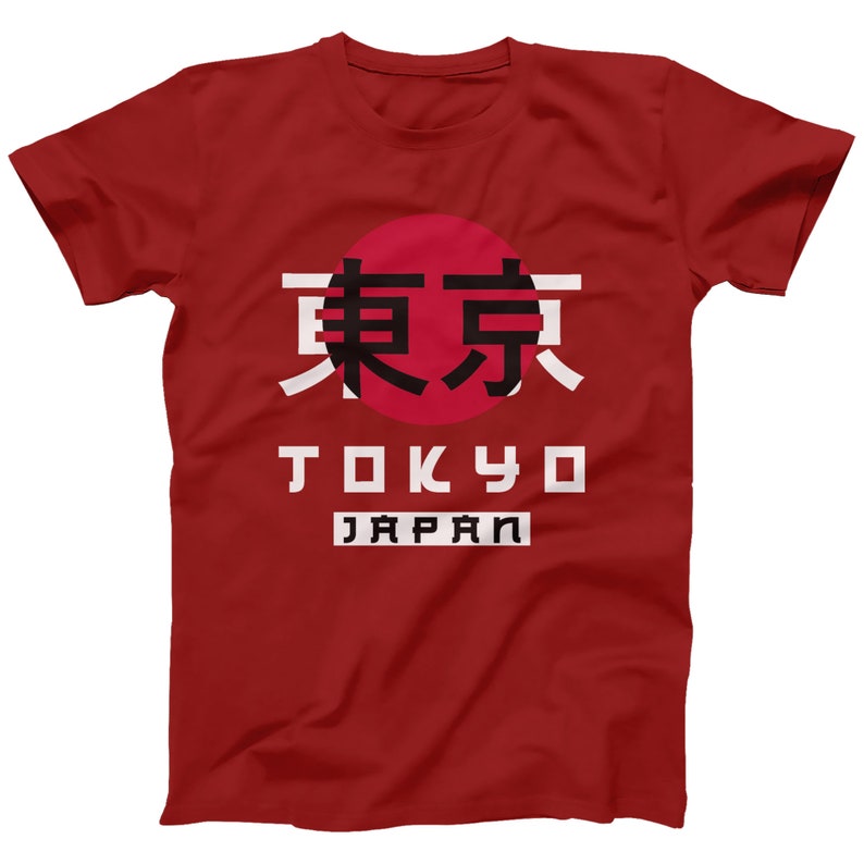May include: Red t-shirt with a white circle and black Japanese characters that say "Tokyo" in English below the circle. The words "Japan" are printed in white below the word "Tokyo".