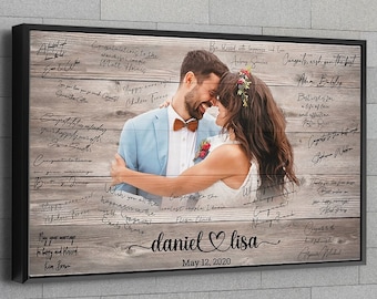 May include: A rustic wooden sign with a photo of a bride and groom embracing. The sign is decorated with handwritten messages and the couple's names, "daniel ♥ lisa", and the date "May 12, 2020".