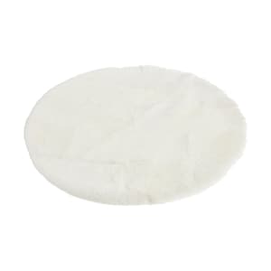 May include: A white fluffy round rug with a soft texture.