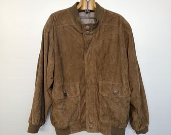 May include: A brown suede bomber jacket with a zipper closure and two front pockets.