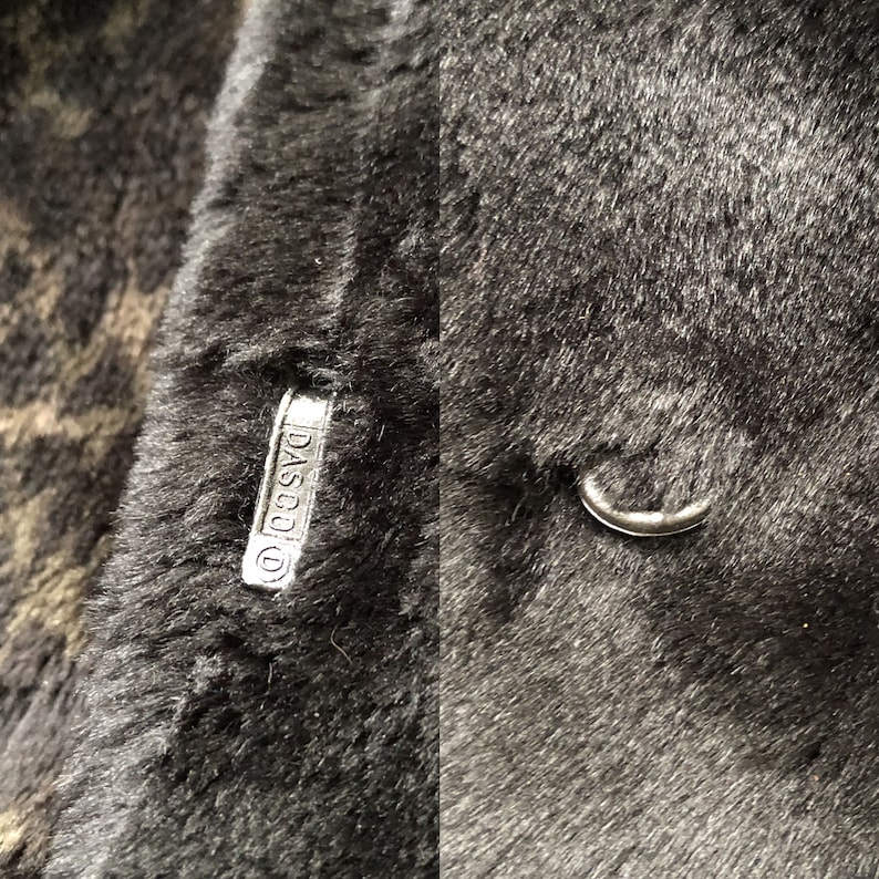 May include: Close-up of a black faux fur coat with a silver metal tag that reads "DASCO".