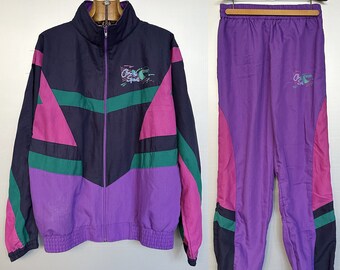 Jaren '90 Vintage geometrisch trainingspak - Colorblock paars, zwart, roze, groen - ongedragen, losse pasvorm, groot