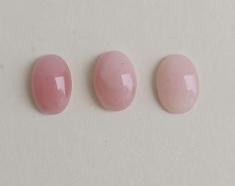 Cabochon ovale ovale en quartz rose naturel de 16 x 12 mm avec des taches noires