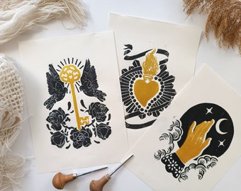 hand printed black and gold linocut prints inspired by ex voto symbols, mystical linocut art, spiritual, healing charms, modern boho, pagan