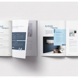 May include: Open magazine spread with the titles "the Great of Designer" and "Artistic of Interior." Pages feature text, images, and blue and gray design elements. The magazine showcases interior design concepts and designer profiles.
