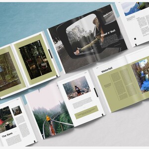 May include: A spread of open magazines with nature photography and text. One spread features a person in a car with the text "Road n' Roll". Other spreads show forest scenes, a waterfall, and a red tent. The magazines are on a light blue surface.