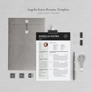 May include: A resume template by Angelia Katro, featuring a black and white design. The layout includes sections for contact information, skills, and work experience. A gray envelope, binder clips, a pen, and a USB drive are also present.