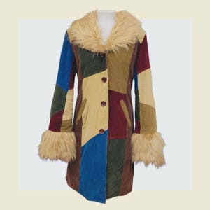 May include: A patchwork corduroy coat with a faux fur collar and cuffs. The coat features a variety of colors, including blue, green, red, and tan. It has three brown buttons down the front and two pockets.