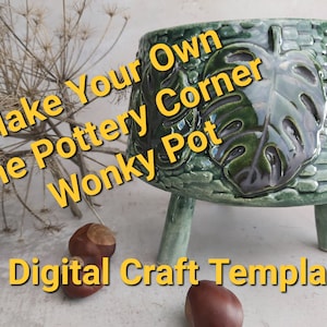 May include: A green ceramic planter with a raised leaf design and three legs. The planter is labeled "Make Your Own The Pottery Corner Wonky Pot" and "Digital Craft Template".