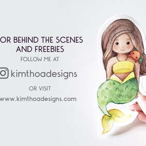 May include: Watercolour illustration of a mermaid with long brown hair, a yellow top, and a green tail. She is holding a small orange fish in her right hand. The illustration is on a white background with the text "kimthoadesigns" and "www.kimthoadesigns.com" below.