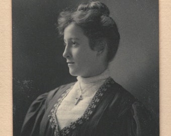 Vintage Black and White Portrait of a Young Edwardian Woman with Cross Necklace Profile