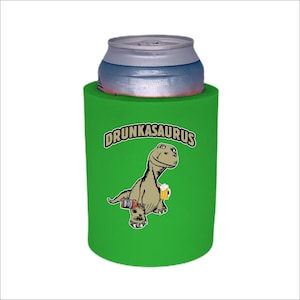 May include: Green can cooler with a cartoon dinosaur holding a beer and the text "DRUNKASAURUS".