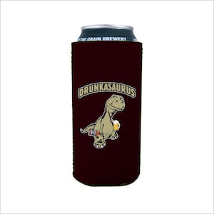 May include: A maroon can cooler with a cartoon dinosaur holding a beer and the text "DRUNKASAURUS".
