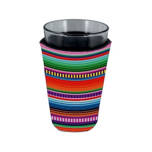 May include: A colorful striped neoprene can cooler with a bright red, orange, yellow, green, blue, and purple pattern. The cooler is designed to fit a standard-sized glass.