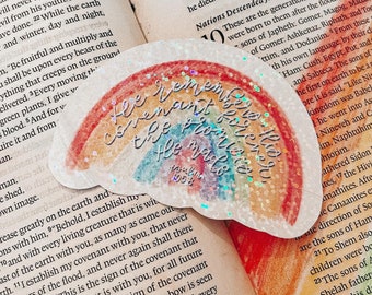 May include: A rainbow-colored sticker with glitter accents. The sticker features a rainbow arch with the words "He remembers the covenant forever he made with us" and the text "Psalm 155:8".