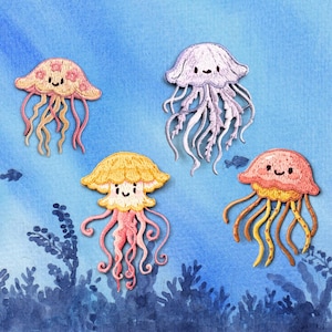 May include: Four embroidered jellyfish patches featuring smiling faces. One is light pink with floral details, one is pale lavender, one is yellow with a pink base, and one is coral with yellow tentacles. Each has multiple dangling tentacles.
