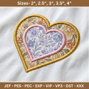 May include: Embroidered heart design with floral patterns in shades of pink, blue, and yellow. The design is outlined with gold and pink stitching. Text at the top reads "Sizes- 2", 2.5", 3", 3.5", 4"" and at the bottom "JEF - PES - PEC - EXP - VIP - VP3 - DST - XXX".