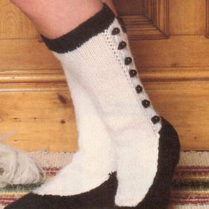 May include: White knitted socks with black trim and black buttons on the back of the leg.