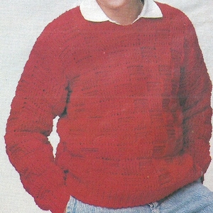 Könnte beinhalten: Ein roter Häkelpullover mit Rundhalsausschnitt.