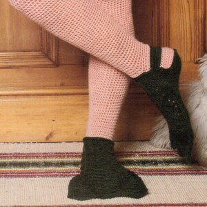 May include: A pair of crocheted slippers, one pink and one green. The pink slipper is a leg warmer style and the green slipper is a bootie style.
