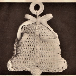 May include: A crocheted white bell ornament with a white satin ribbon and a crocheted loop for hanging.