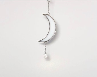 Small white crescent moon with crystal