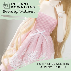 May include: A PDF instant download sewing pattern for a 1/3 scale BJD and vinyl doll dress. The dress is pink and white gingham with a white ribbon bow at the waist and a white floral lace trim along the hem, worn by a doll with long blonde hair.
