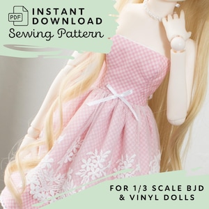 May include: Pink gingham and lace dress for a 1/3 scale BJD or vinyl doll. The dress has a white ribbon bow at the waist and a white lace trim. The dress is for sale as a sewing pattern.