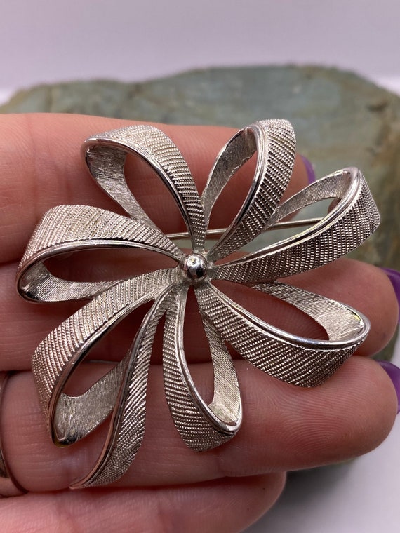 Vintage Monet Silver Tone Textured Bow Brooch Pin… - image 1