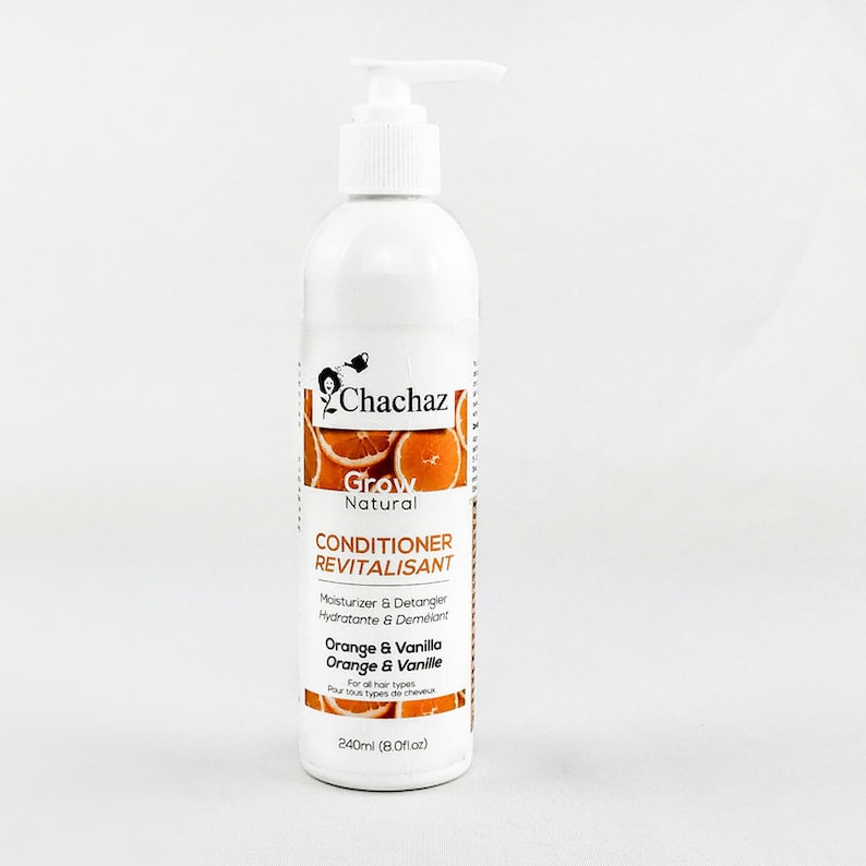 May include: White bottle of Chachaz Grow Natural Conditioner Revitalisant with a pump dispenser. The label features orange slices and text: "Orange & Vanilla". The bottle contains 240ml of product, designed for all hair types.