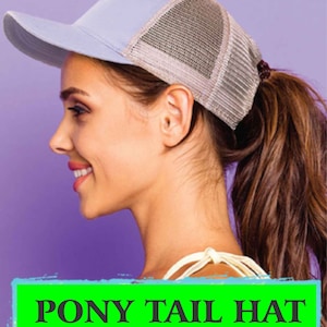 May include: A light blue and grey baseball cap with a ponytail hole in the back. The cap has a mesh back and a solid front.