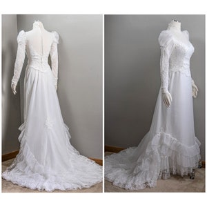 May include: A vintage white wedding dress with long sleeves, a high neckline, and a lace bodice. The dress has a full skirt with ruffles and a long train.