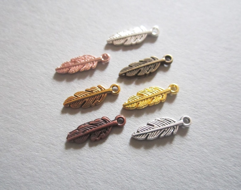 10x feather pendants 15 mm 7 colors to choose from image 1