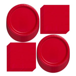 May include: A set of red paper plates and napkins. The plates are round and the napkins are square. There are 20 plates and 20 napkins in the set.