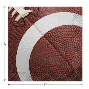 May include: A brown and white football with laces. The football is 5 inches wide and 5 inches tall.