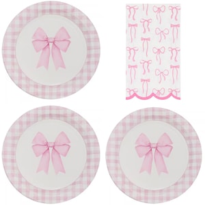 May include: Four white plates with pink bow designs and a pink gingham border. A matching napkin with pink bow patterns is also shown. The plates and napkin are perfect for a tea party or a special occasion.
