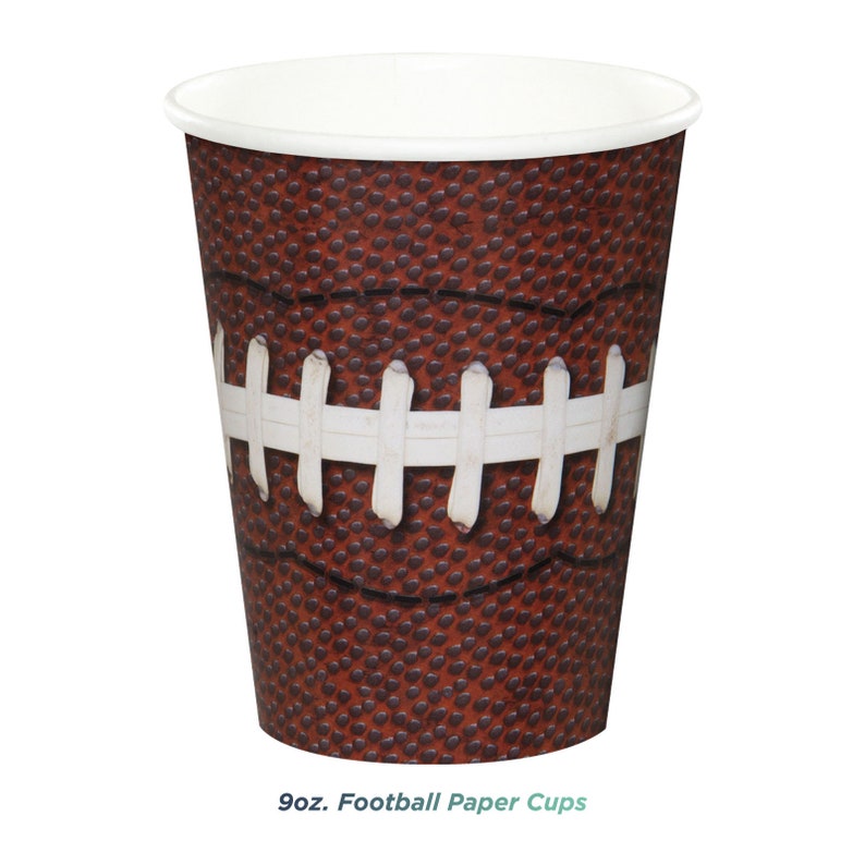 May include: 9 oz. Football Paper Cups. Brown paper cups with a football design. The cups have a white rim and a white football lace design.