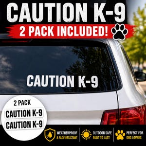May include: White "CAUTION K-9" car window decals. The image shows a car with a decal on the window and two additional decals. The text "2 PACK INCLUDED!" is above the window decal. The decals are weatherproof and fade resistant.