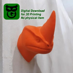 May include: A bright orange 3D printed wall mount sculpture of a rhinoceros head. The text in the upper left corner reads: Digital Download for 3D Printing No physical item. The sculpture features a prominent horn and defined facial features.