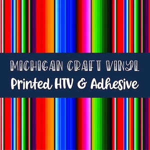May include: A colorful striped pattern with red, orange, yellow, green, blue, purple, and black stripes. The text "MICHIGAN CRAFT VINYL Printed HTV & Adhesive" is displayed on a dark blue banner.