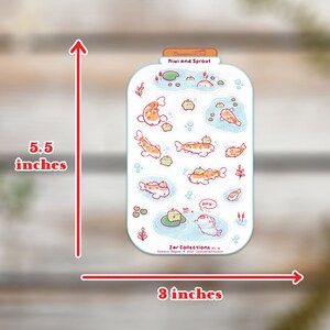 May include: A sticker sheet featuring a jar design with koi fish and other aquatic elements. The sticker sheet is 5.5 inches tall and 8 inches wide. The text "Kiwi and Sprout" is at the top. The sticker sheet has a light blue background.