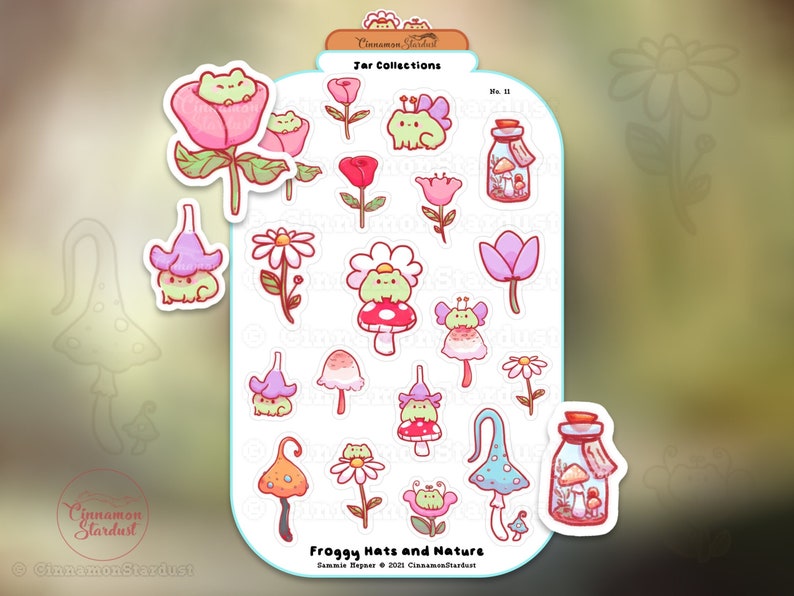 May include: A sheet of stickers featuring whimsical illustrations of frogs wearing hats and surrounded by flowers and mushrooms. The stickers include a jar with mushrooms inside and the text "Froggy Hats and Nature". The color palette includes pink, green, and blue.