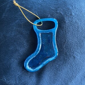 Turquoise colored glass stocking ornament