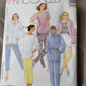 May include: A vintage McCall's sewing pattern envelope featuring illustrations of various loungewear outfits. The envelope has the text "Easy McCall's" and "Learn to Sew for Fun". The outfits include a hooded jacket, pants, and shorts.